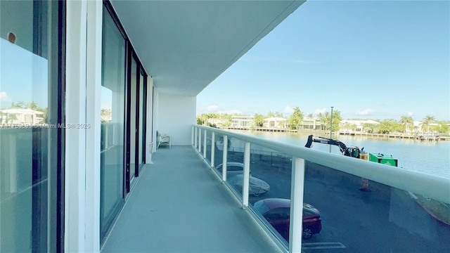 balcony featuring a water view