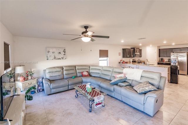 living room with light tile patterned floors, a ceiling fan, and recessed lighting