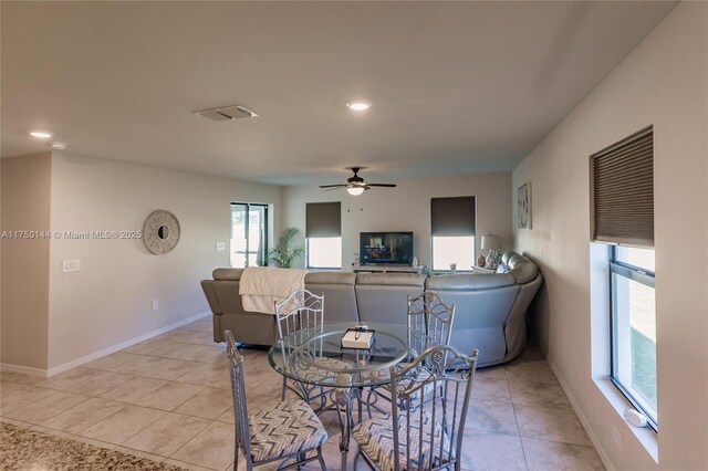 dining space featuring light tile patterned floors, recessed lighting, visible vents, a ceiling fan, and baseboards