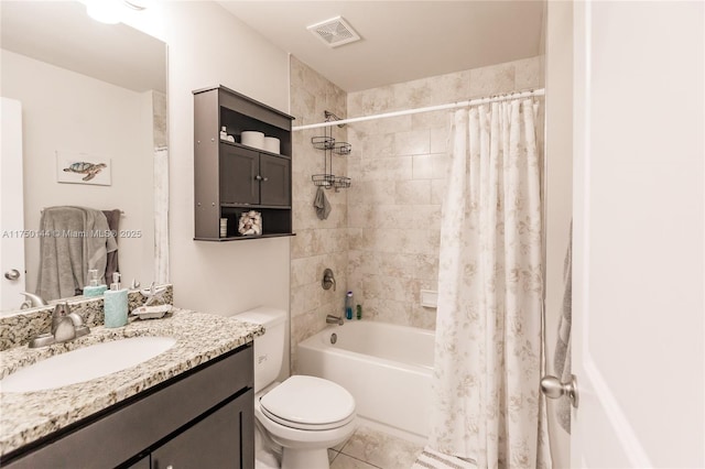 bathroom with visible vents, toilet, shower / bath combo, vanity, and tile patterned floors