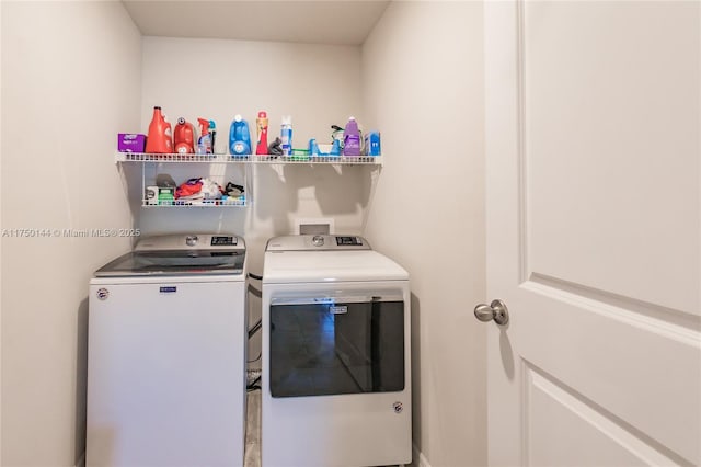 clothes washing area featuring laundry area and independent washer and dryer