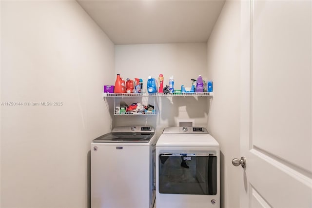 laundry room featuring laundry area and separate washer and dryer