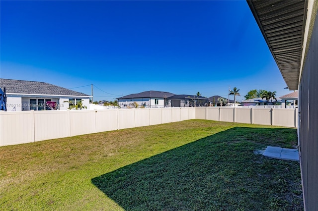 view of yard featuring a fenced backyard