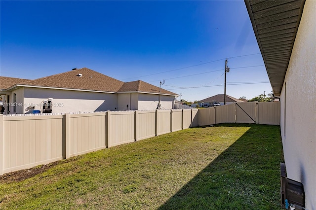 view of yard featuring a fenced backyard