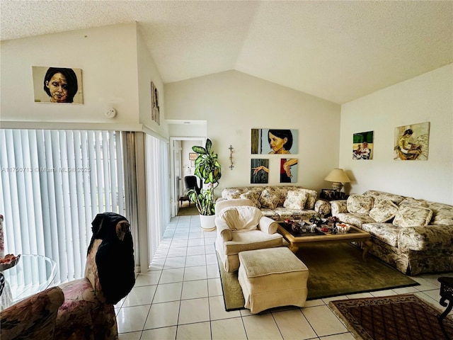 living room with lofted ceiling, a textured ceiling, and light tile patterned flooring