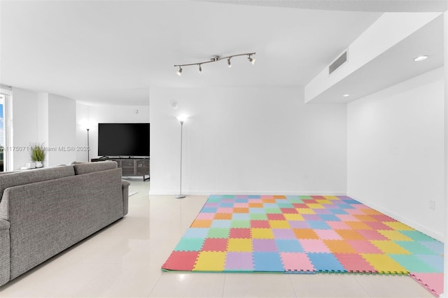 recreation room with baseboards, visible vents, tile patterned flooring, and recessed lighting