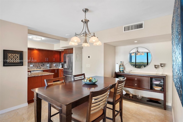 dining room featuring visible vents and baseboards