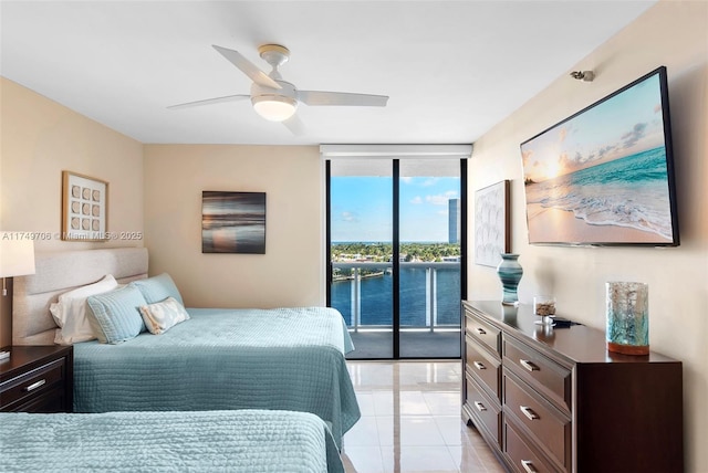 bedroom with access to exterior, floor to ceiling windows, ceiling fan, and light tile patterned floors