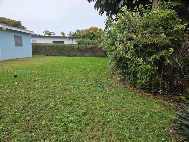 view of yard featuring fence