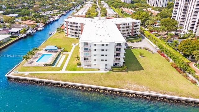 birds eye view of property with a water view