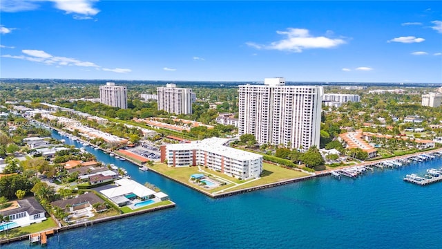 birds eye view of property with a view of city and a water view