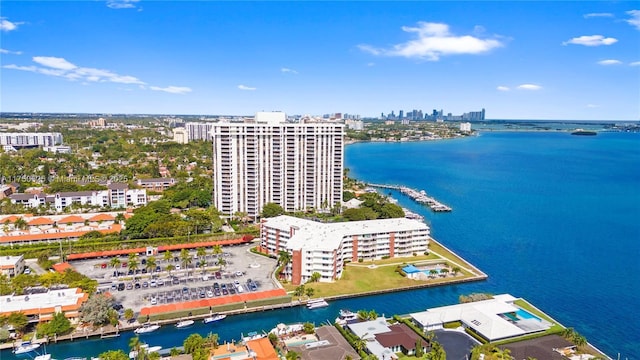 birds eye view of property featuring a view of city and a water view