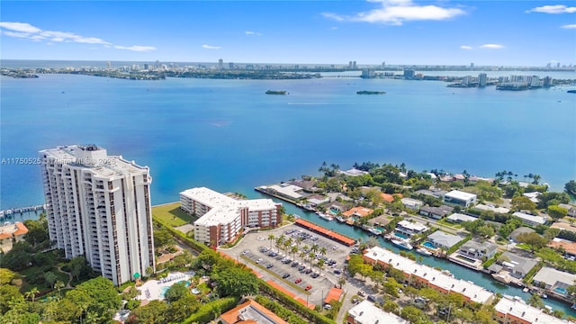 birds eye view of property with a view of city and a water view