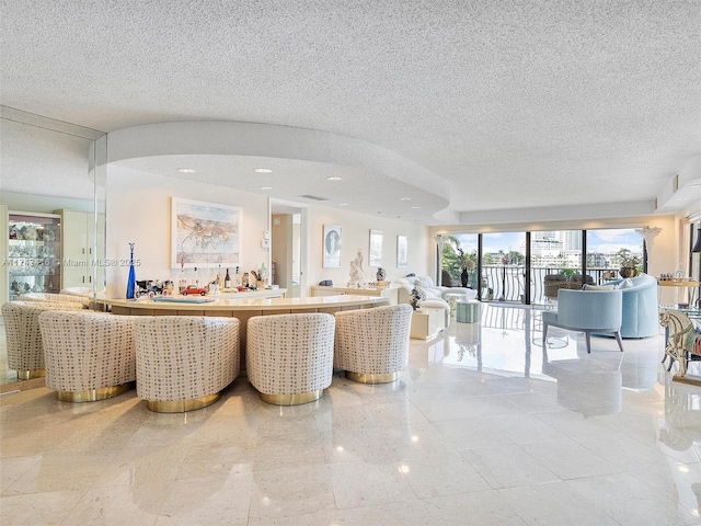 living room with a textured ceiling