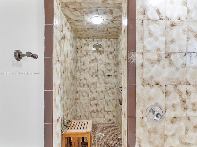 full bath featuring a tile shower