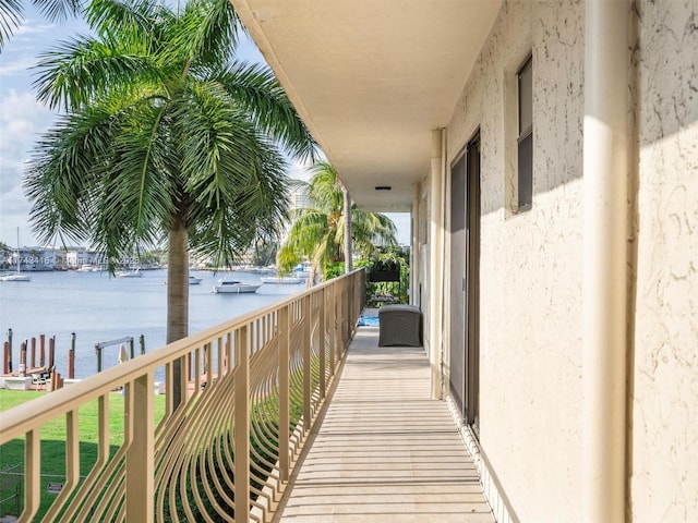 balcony featuring a water view