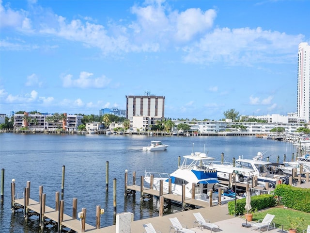 view of dock featuring a water view and a city view