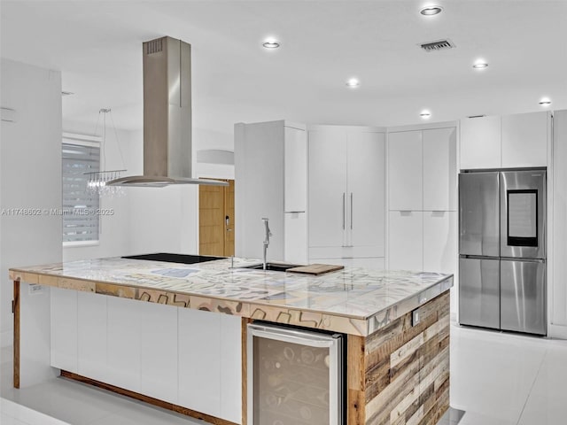 kitchen featuring island range hood, beverage cooler, white cabinetry, smart refrigerator, and modern cabinets