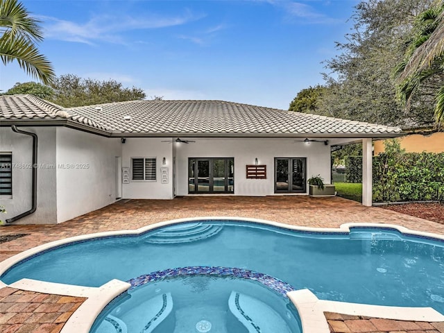 view of pool featuring a pool with connected hot tub and ceiling fan