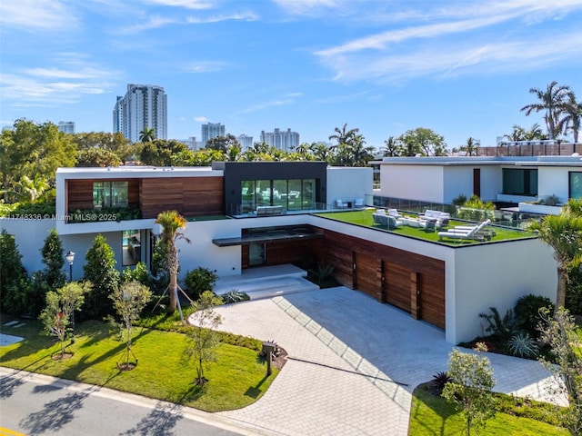 contemporary home with a city view and stucco siding