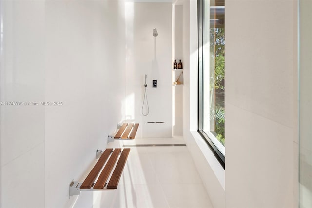 hallway featuring light tile patterned floors