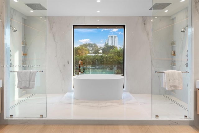 full bath with a marble finish shower, visible vents, and a freestanding bath