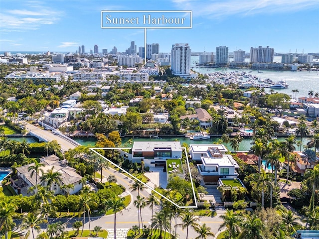 bird's eye view featuring a water view and a city view