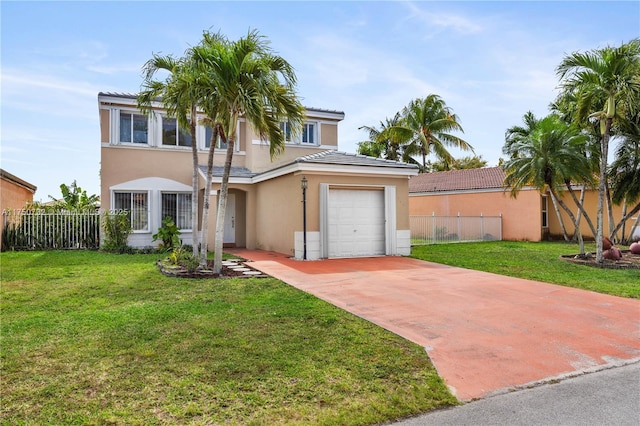 view of front of property with a garage, fence, concrete driveway, stucco siding, and a front yard