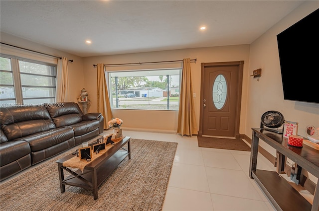 living area with light tile patterned floors, baseboards, and recessed lighting