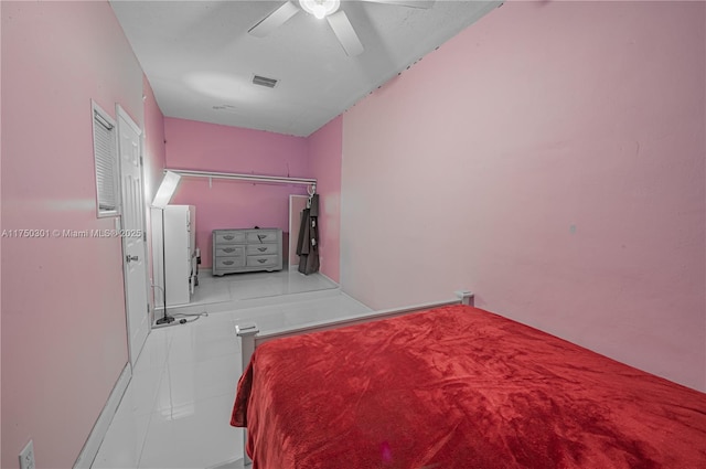 tiled bedroom with ceiling fan and visible vents