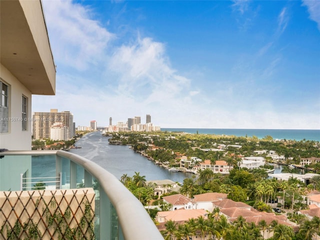 balcony with a water view and a city view