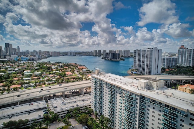 aerial view featuring a water view and a city view