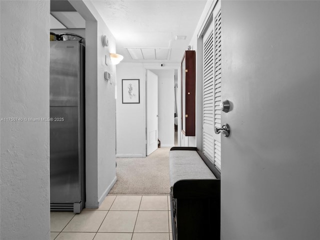 19390 Collins Ave Unit Ph-24, Sunny Isles Beach, FL 33160 - hall with attic access, light tile patterned floors, and light colored carpet