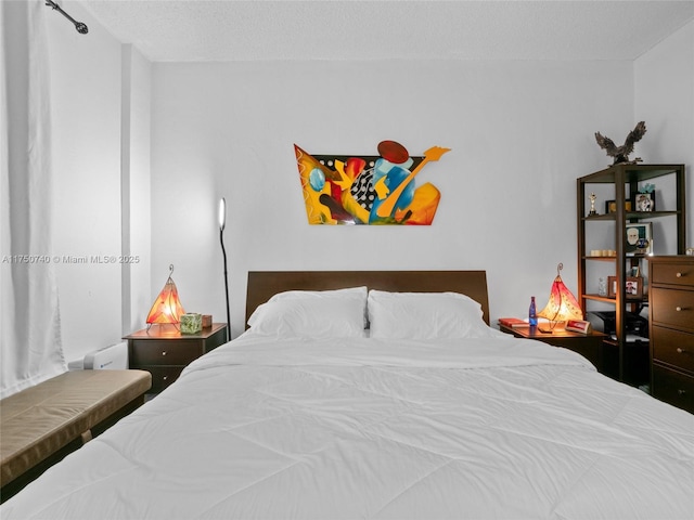 bedroom featuring a textured ceiling