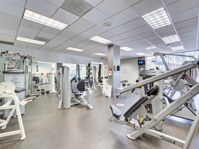 workout area featuring visible vents and a drop ceiling