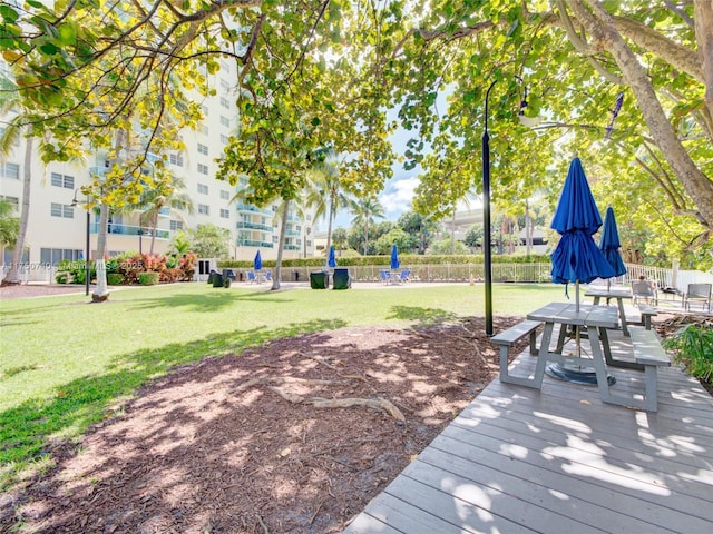 exterior space featuring a lawn and fence