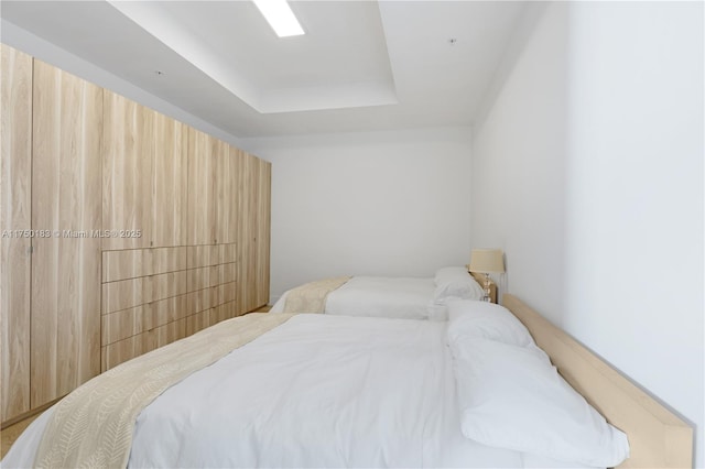 bedroom with a tray ceiling