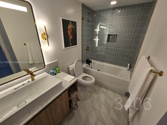 bathroom with  shower combination, tile patterned floors, toilet, and vanity