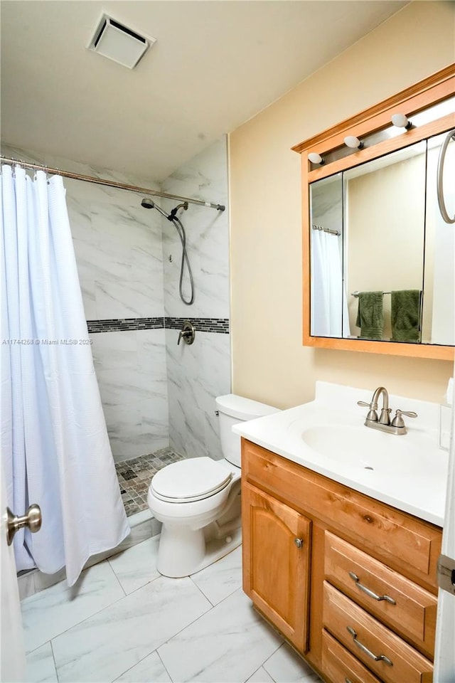 full bath with a stall shower, visible vents, toilet, marble finish floor, and vanity