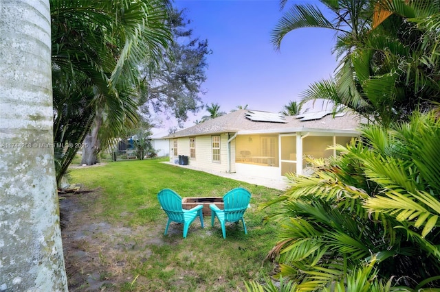 view of yard featuring cooling unit and a sunroom