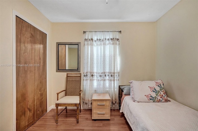 bedroom with dark wood finished floors