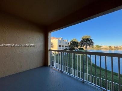 balcony featuring a water view