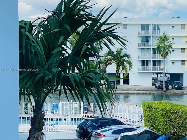 view of property with a water view and fence