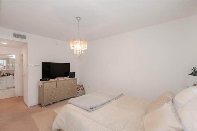bedroom with a chandelier, visible vents, and light colored carpet