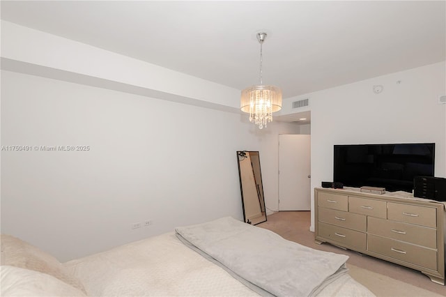 bedroom featuring a chandelier, visible vents, and light colored carpet