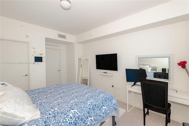 bedroom featuring light carpet, visible vents, and baseboards