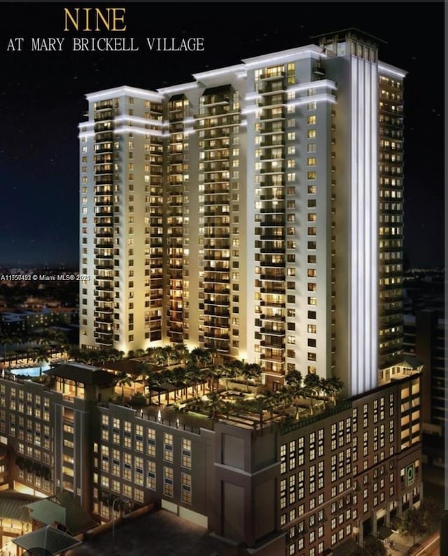 property at twilight featuring a view of city lights