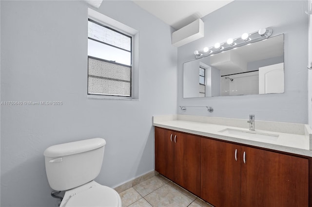 full bath with a shower, vanity, toilet, and tile patterned floors