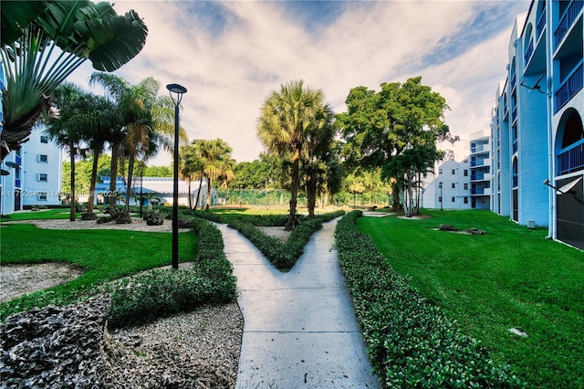 view of home's community featuring a lawn