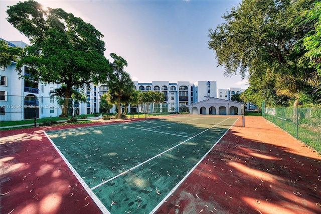 view of sport court with fence